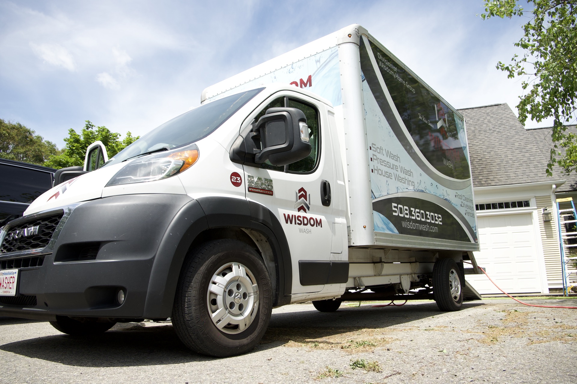 Wisdom Wash service van at a freshly cleaned Cape Cod home