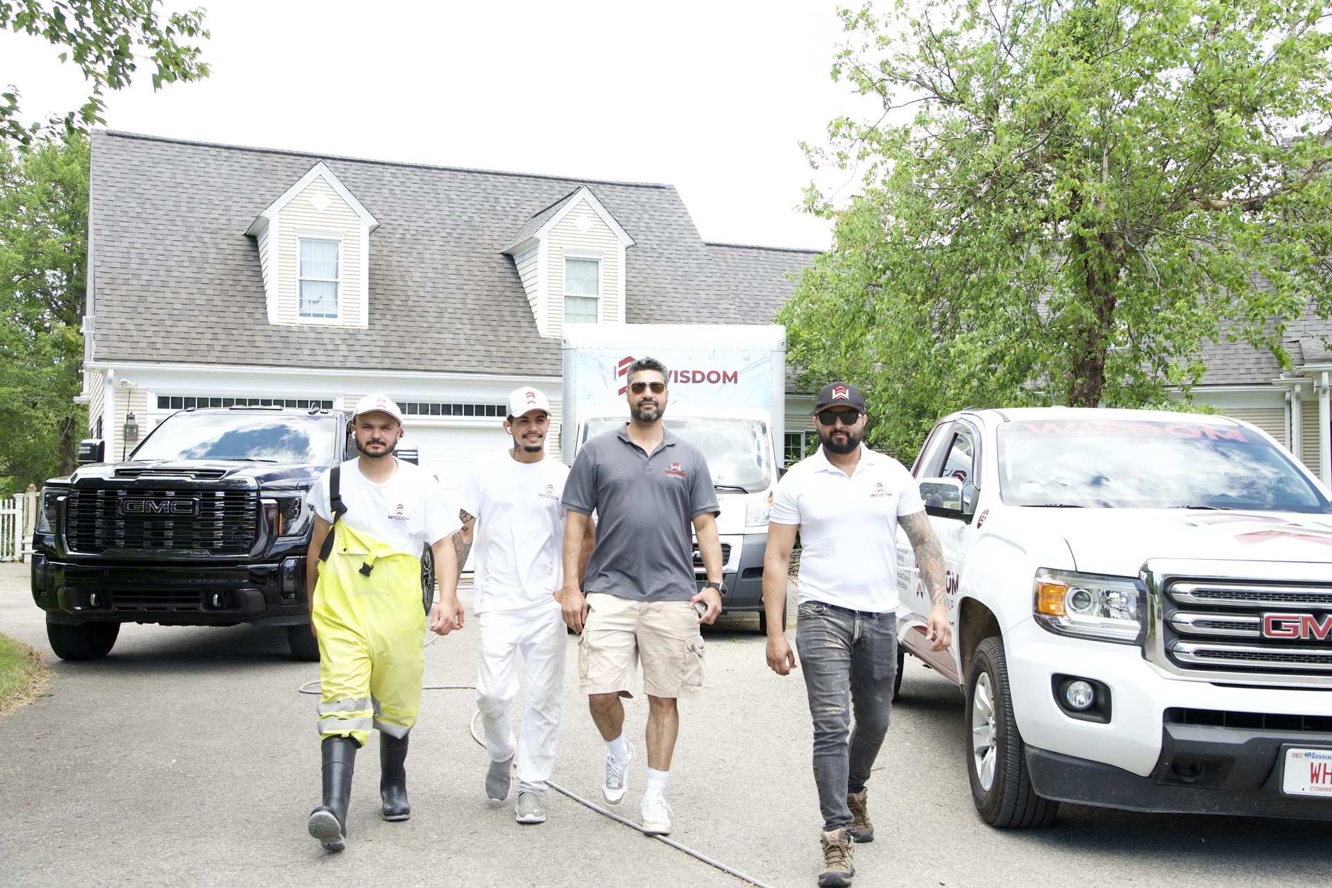 The Wisdom Wash team on site with the service fleet